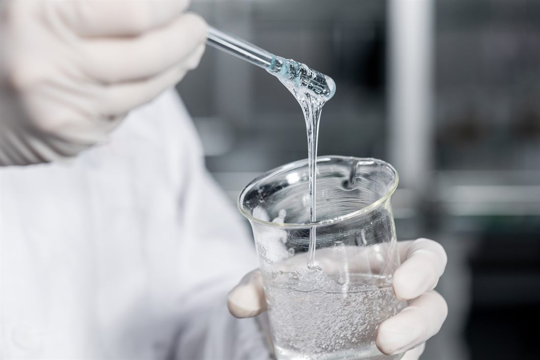 Viscous specialty chemical being handled in a laboratory
